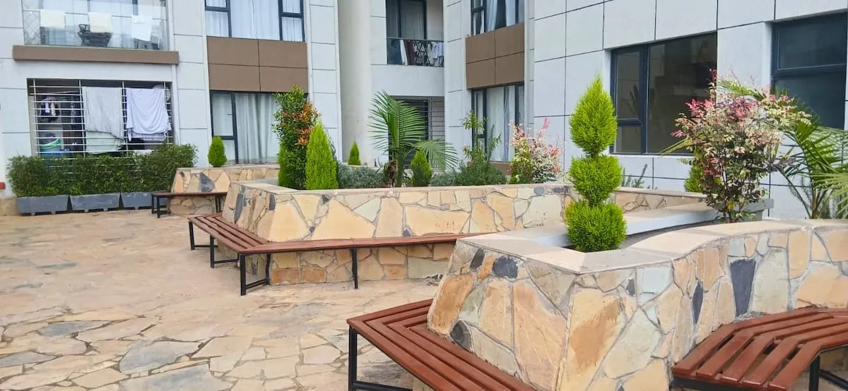 Courtyard garden with seating in a Pretty Fly Living building