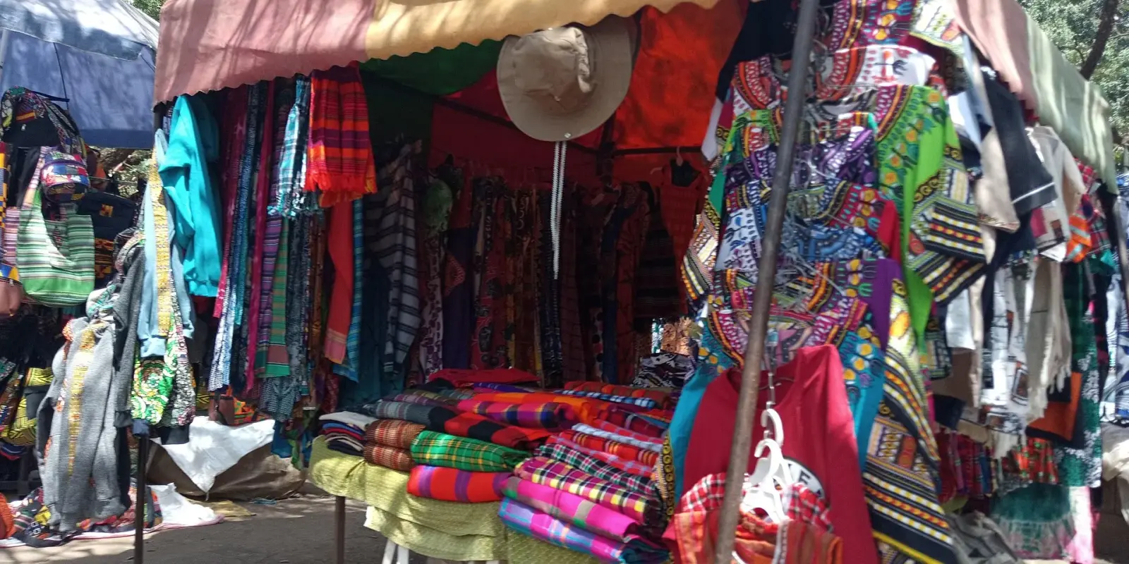 Shuka blankets and printed cloth on a Maasai Market stall