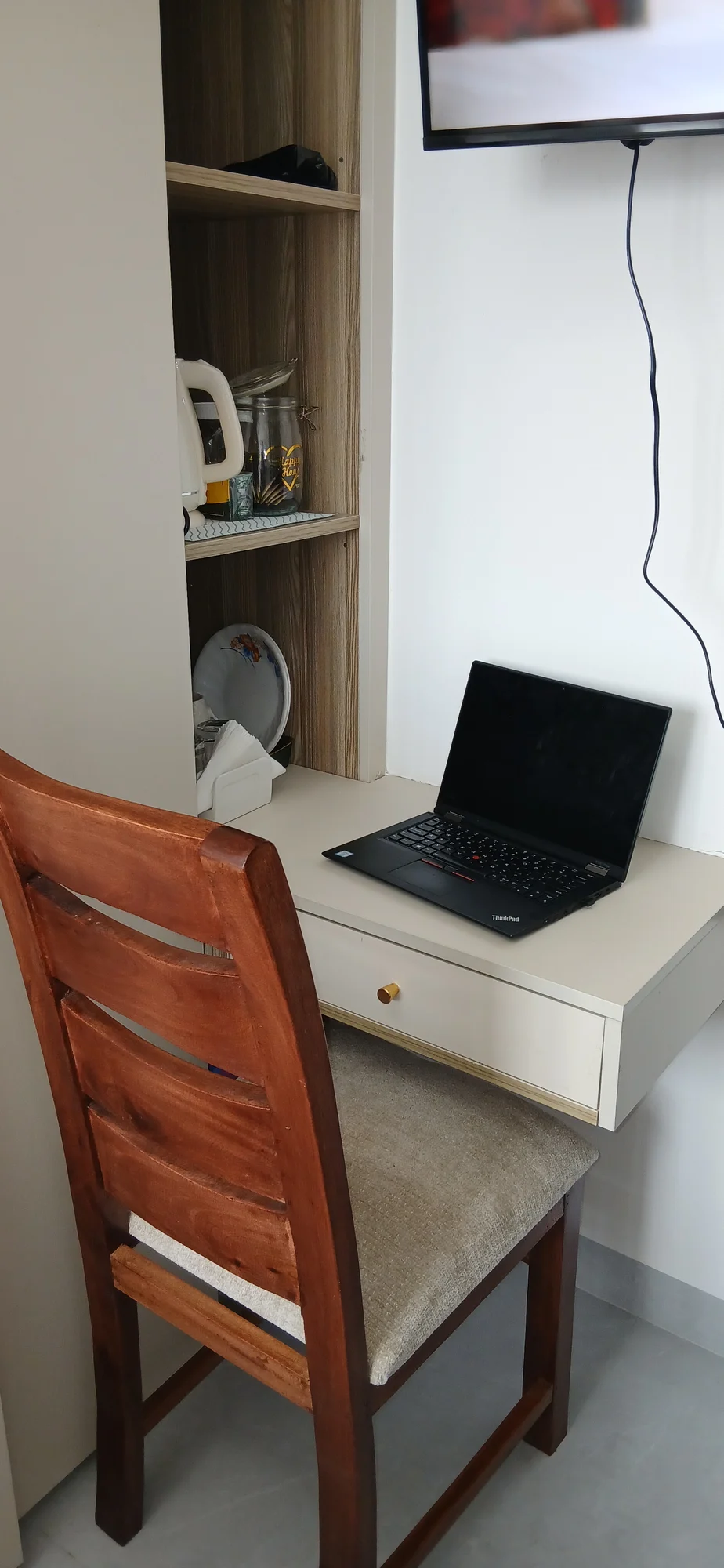 Work desk and chair with shelves and the smart TV